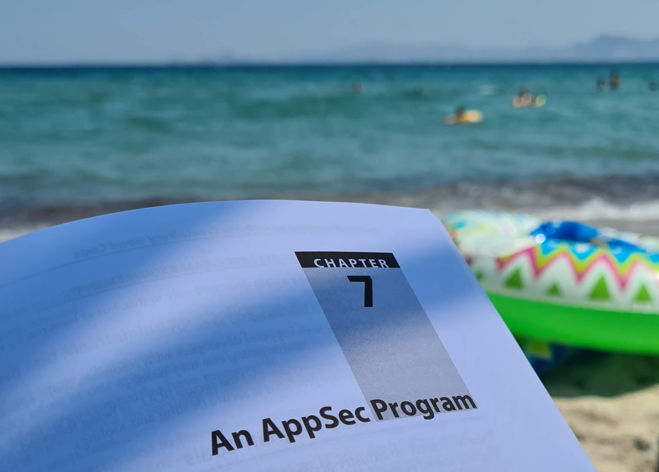Learning about AppSec at the beach of Kos. The Sea and playing kids in the background